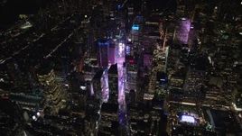 5.5K aerial stock footage orbit and approach Times Square at Night in Midtown, New York City Aerial Stock Footage | AX122_174E