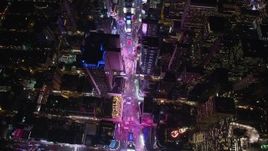 5.5K aerial stock footage tilt to bird's eye of Times Square at Night in Midtown Manhattan, NYC Aerial Stock Footage | AX122_176E