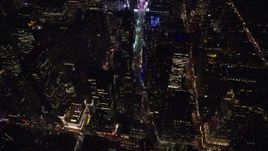 5.5K aerial stock footage approach and tilt to Broadway in Midtown Manhattan, New York City at Night Aerial Stock Footage | AX122_184