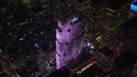 5.5K aerial stock footage of an orbit of Rockefeller Center at Night in Midtown Manhattan, New York City Aerial Stock Footage | AX122_199E