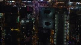 5.5K aerial stock footage of a bird's eye of 42nd and 43rd streets at Night in Midtown Manhattan, New York City Aerial Stock Footage | AX122_222E