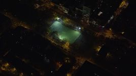 5.5K aerial stock footage orbit a soccer field on the Lower East Side at Night in New York City Aerial Stock Footage | AX122_239