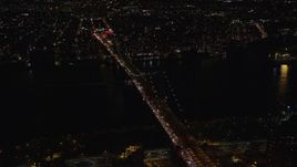 5.5K aerial stock footage approach and orbit Williamsburg Bridge at Night in New York City Aerial Stock Footage | AX122_241