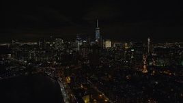 5.5K aerial stock footage of Lower Manhattan seen from Manhattan Bridge at Night in NYC Aerial Stock Footage | AX122_259E