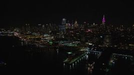 5.5K aerial stock footage of Chelsea piers and riverfront office buildings at Night in New York City Aerial Stock Footage | AX122_294