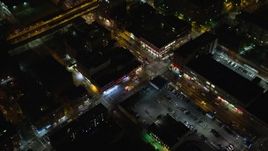 5.5K aerial stock footage approach and bird's eye of ambulances on a Harlem street at Night in New York City Aerial Stock Footage | AX123_033