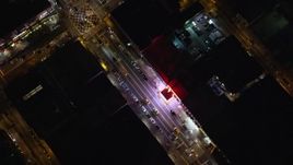5.5K aerial stock footage of flying over 125th Street office buildings and shops in Harlem at Night in New York City Aerial Stock Footage | AX123_034E