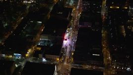 5.5K aerial stock footage fly away from a Harlem shop on 125th Street at Night in NYC Aerial Stock Footage | AX123_038