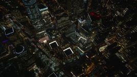 5.5K aerial stock footage of a reverse view of the World Trade Center Memorial at Night in Lower Manhattan, NYC Aerial Stock Footage | AX123_085