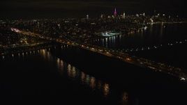 5.5K aerial stock footage approach the Williamsburg Bridge at Night in New York City Aerial Stock Footage | AX123_099E