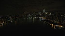 5.5K aerial stock footage approach Manhattan Bridge and Lower Manhattan skyline at Night in New York City Aerial Stock Footage | AX123_101E