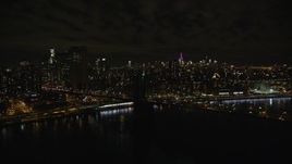 5.5K aerial stock footage of an orbit of the Manhattan side of the Brooklyn Bridge at Night in New York City Aerial Stock Footage | AX123_110E