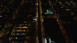 5.5K aerial stock footage of a bird's eye of an elevated train and Atlantic Avenue in Brooklyn at Night, New York City Aerial Stock Footage | AX123_127