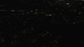 5.5K aerial stock footage of flying over suburban homes at Night in Hempstead, New York Aerial Stock Footage | AX123_153E