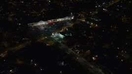 5.5K aerial stock footage approach suburban strip mall at Night in Hempstead, New York Aerial Stock Footage | AX123_155E