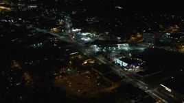 5.5K aerial stock footage approach shops and restaurants at Night in West Hempstead, New York Aerial Stock Footage | AX123_159E