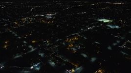 5.5K aerial stock footage fly over warehouses and suburban homes at Night in Hempstead, New York Aerial Stock Footage | AX123_161