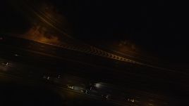 5.5K aerial stock footage of a bird's eye view of cars on Southern State Parkway at Night in Massapequa, New York Aerial Stock Footage | AX123_183E