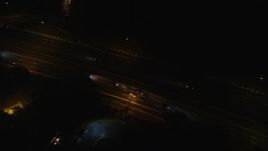 5.5K aerial stock footage of a bird's eye view of light traffic on Southern State Parkway at Night in Farmingdale, New York Aerial Stock Footage | AX123_186