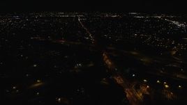 5.5K aerial stock footage orbit Southern State Parkway and Carmans Road at Night in Farmingdale, New York Aerial Stock Footage | AX123_187