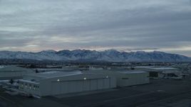 5.5K aerial stock footage of the Wasatch Range seen from SLC International Airport in Winter at Sunrise, Utah Aerial Stock Footage | AX124_001
