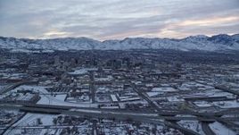 5.5K aerial stock footage of approaching Downtown Salt Lake City at Sunrise in Utah in Winter Aerial Stock Footage | AX124_007E