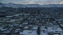 5.5K aerial stock footage orbit of Downtown Salt Lake City and 200 South at Sunrise in Winter in Utah Aerial Stock Footage | AX124_009