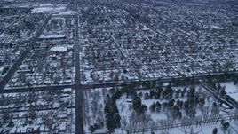 5.5K aerial stock footage fly over Liberty Park and suburbs at Sunrise in Winter, Salt Lake City, Utah Aerial Stock Footage | AX124_013E