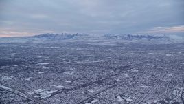 5.5K aerial stock footage of suburban neighborhoods in Salt Lake City, Utah, at Sunrise in Winter Aerial Stock Footage | AX124_029E