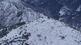 5.5K aerial stock footage of snowy top of Grandeur Peak in Winter at Sunrise in Utah Aerial Stock Footage | AX124_031E