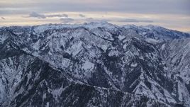 5.5K aerial stock footage approach snowy mountains in the Wasatch Range at Sunrise in Utah Aerial Stock Footage | AX124_035