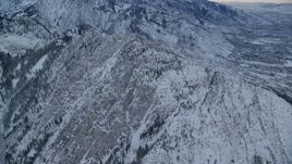 5.5K aerial stock footage approach snowy summit of Mount Olympus at winter sunrise in Utah Aerial Stock Footage | AX124_044