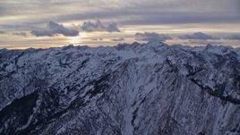 5.5K aerial stock footage of snow mountains of the Wasatch Range at sunrise in Utah Aerial Stock Footage | AX124_052E