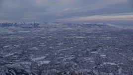 5.5K aerial stock footage of vast Salt Lake City suburban neighborhoods at sunrise in winter, Utah Aerial Stock Footage | AX124_061
