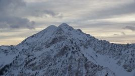 5.5K aerial stock footage orbit Wasatch Range peak with winter snow in Utah Aerial Stock Footage | AX124_062