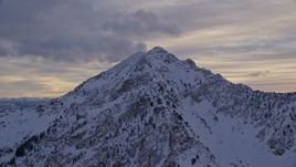 5.5K aerial stock footage a Wasatch Range peak with winter snow in Utah Aerial Stock Footage | AX124_062E