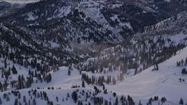 5.5K aerial stock footage orbit mountain snowdrifts at sunrise in the Wasatch Range of Utah Aerial Stock Footage | AX124_079