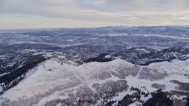 5.5K aerial stock footage approach snowy ridge at sunrise in Wasatch Range, Utah Aerial Stock Footage | AX124_086E