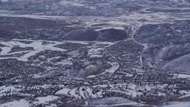 5.5K aerial stock footage orbit small town neighborhoods with winter snow at sunrise in Park City, Utah Aerial Stock Footage | AX124_092