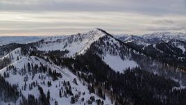 5.5K aerial stock footage approach two Wasatch Range peaks with snow at sunrise in Utah's Wasatch Range Aerial Stock Footage | AX124_117E
