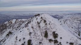 5.5K aerial stock footage fly over Grandeur Peak to reveal Salt Lake City at sunrise, Utah Aerial Stock Footage | AX124_172E