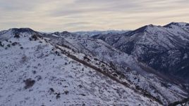 5.5K aerial stock footage the summit of Grandeur Peak with winter snow at sunrise in Utah Aerial Stock Footage | AX124_176E
