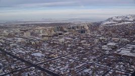 5.5K aerial stock footage approach Downtown Salt Lake City from suburbs with snow at sunrise, Utah Aerial Stock Footage | AX124_192E