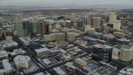 5.5K aerial stock footage orbit of Downtown Salt Lake City with winter snow at sunrise in Utah Aerial Stock Footage | AX124_197