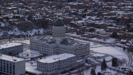 5.5K aerial stock footage of circling the Utah State Capitol in winter snow at sunrise, Salt Lake City Aerial Stock Footage | AX124_204