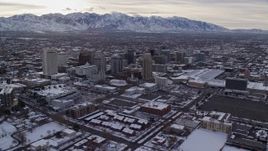 5.5K aerial stock footage orbit Downtown Salt Lake City and Salt Lake Temple with snow at sunrise, Utah Aerial Stock Footage | AX124_205
