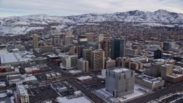 5.5K aerial stock footage of circling snowy Downtown Salt Lake City in winter at sunrise in Utah Aerial Stock Footage | AX124_209E