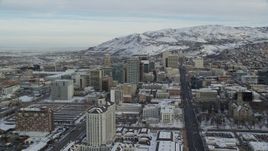 5.5K aerial stock footage orbit and approach State Street in Downtown Salt Lake City with snow at sunrise, Utah Aerial Stock Footage | AX124_212