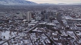 5.5K aerial stock footage orbit snowy Utah State Capitol to approach Downtown Salt Lake City in winter at sunrise Aerial Stock Footage | AX124_220E