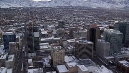 5.5K aerial stock footage orbit Downtown Salt Lake City and reveal Wasatch Range at sunrise, Utah Aerial Stock Footage | AX124_225